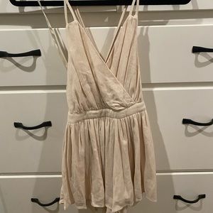 Strappy romper in light peach